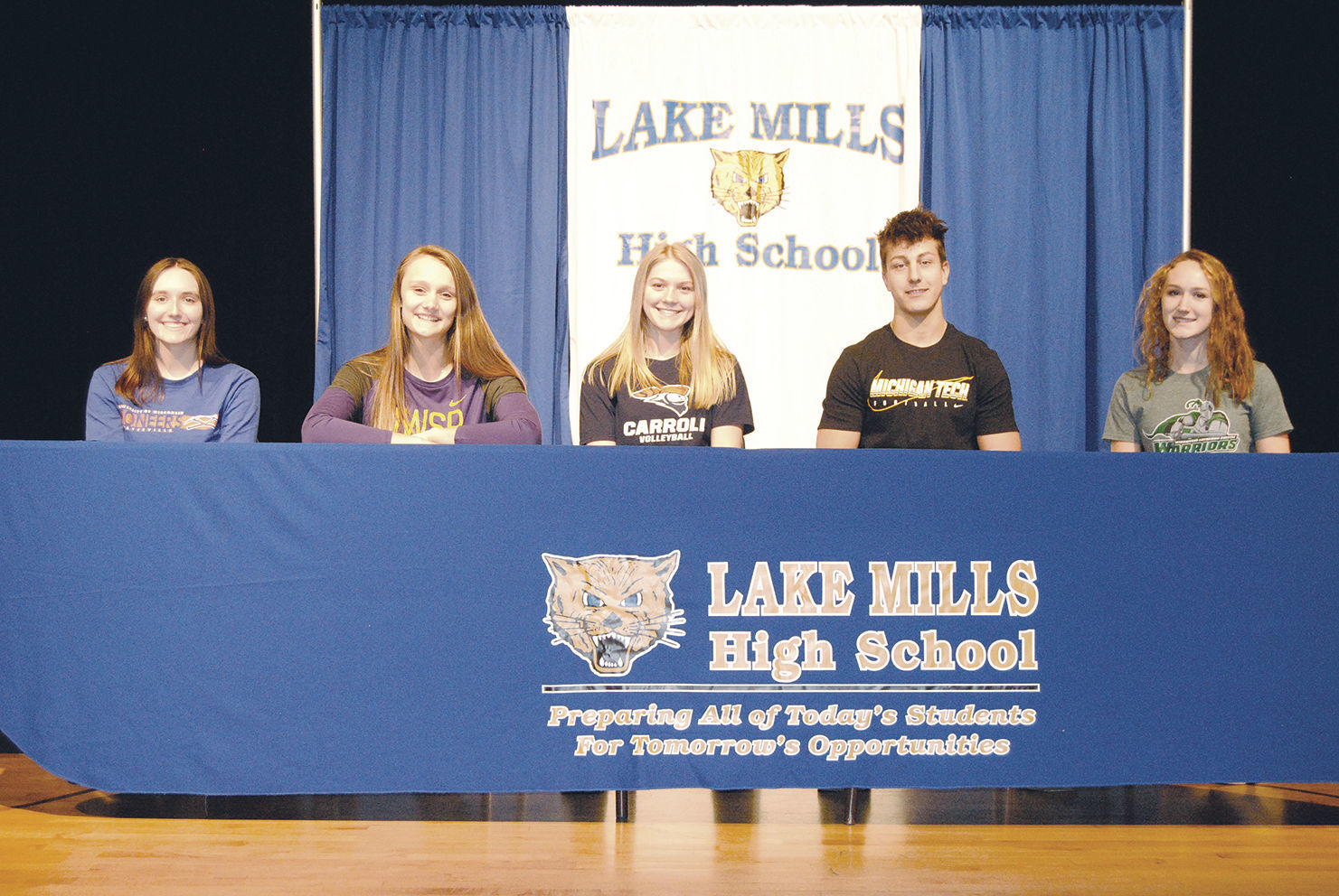 Five students sign